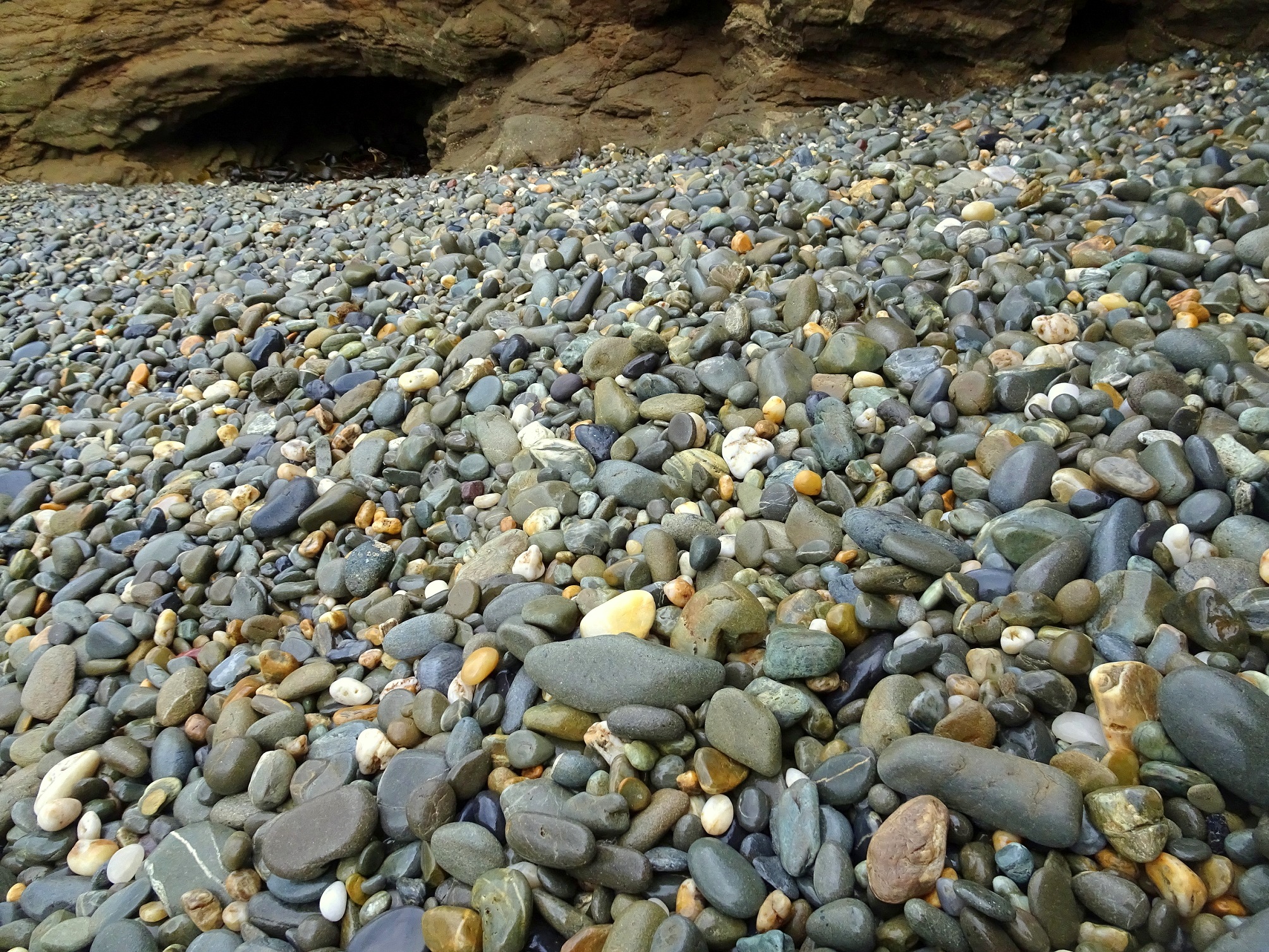 Kakanui beach stones in a small bay in some rocks at the south end of the beach.