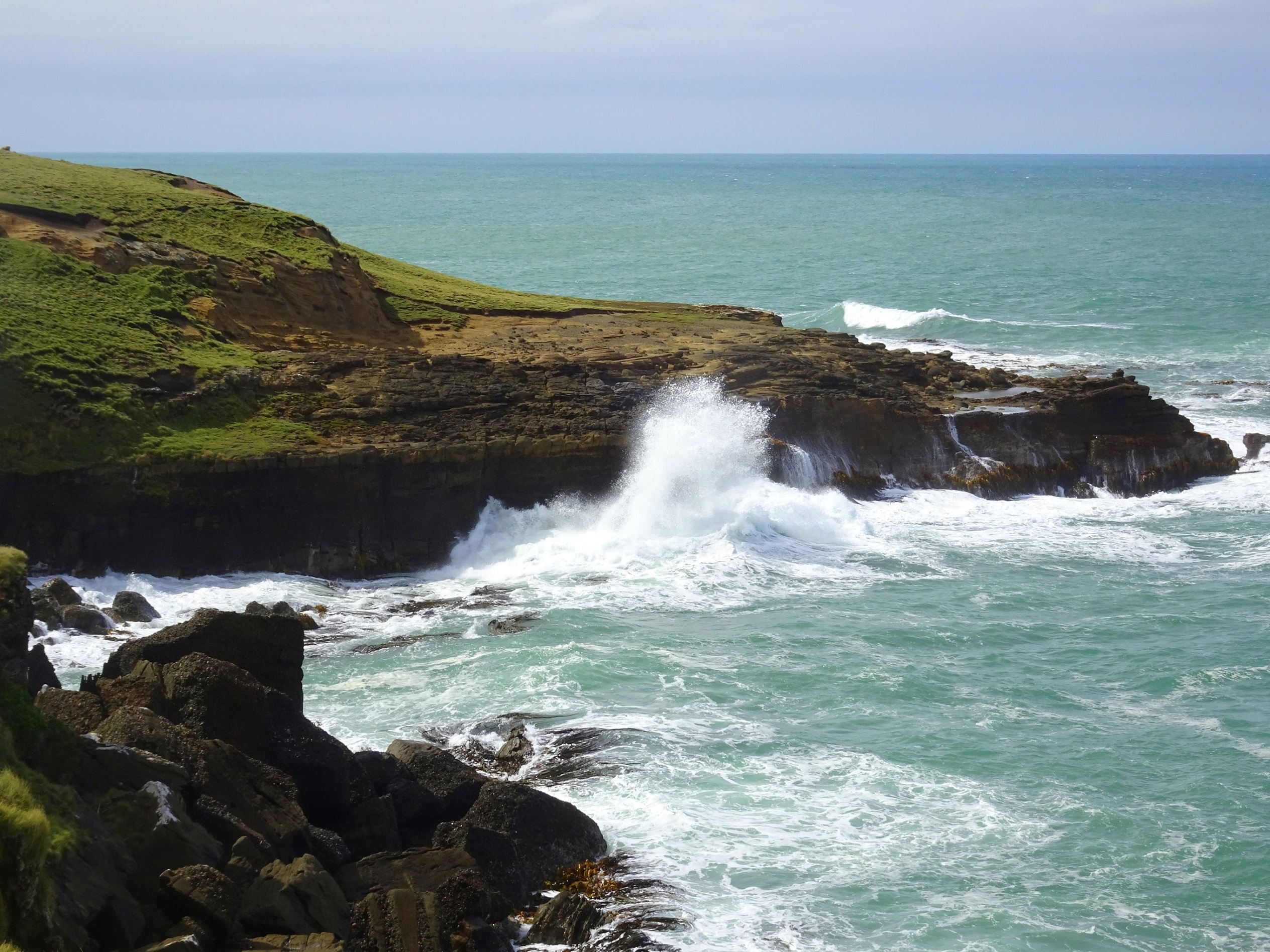 High cliffs and rough sea at Slope Point.