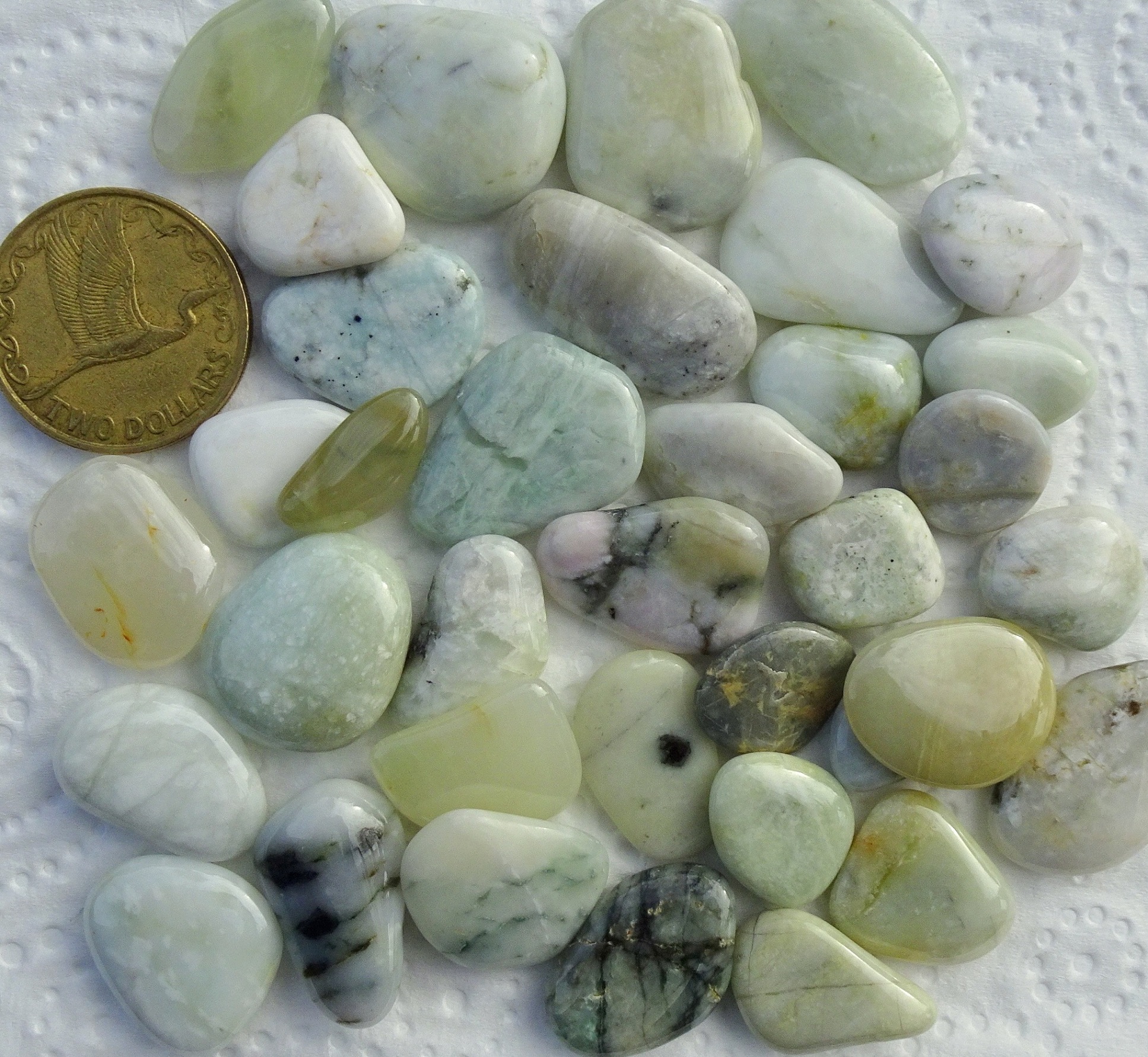 Small polished hydrogrossular garnets.