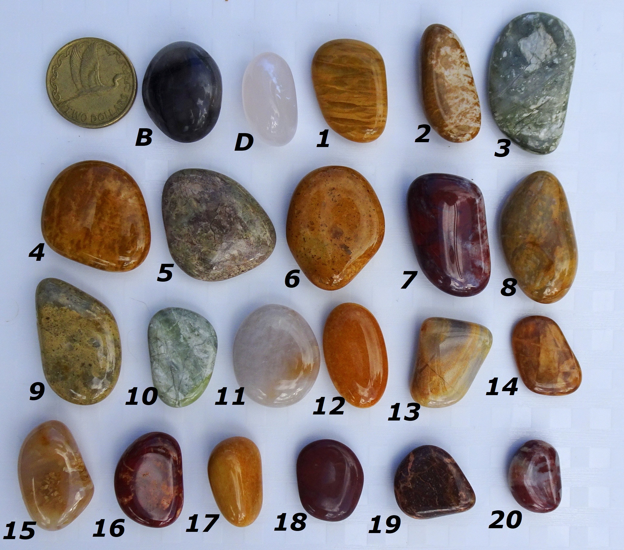 B = Barb's stone. D = Derek's stone. $2 coin for scale. The rest are the other 20 Kakaknui stones I sent them.