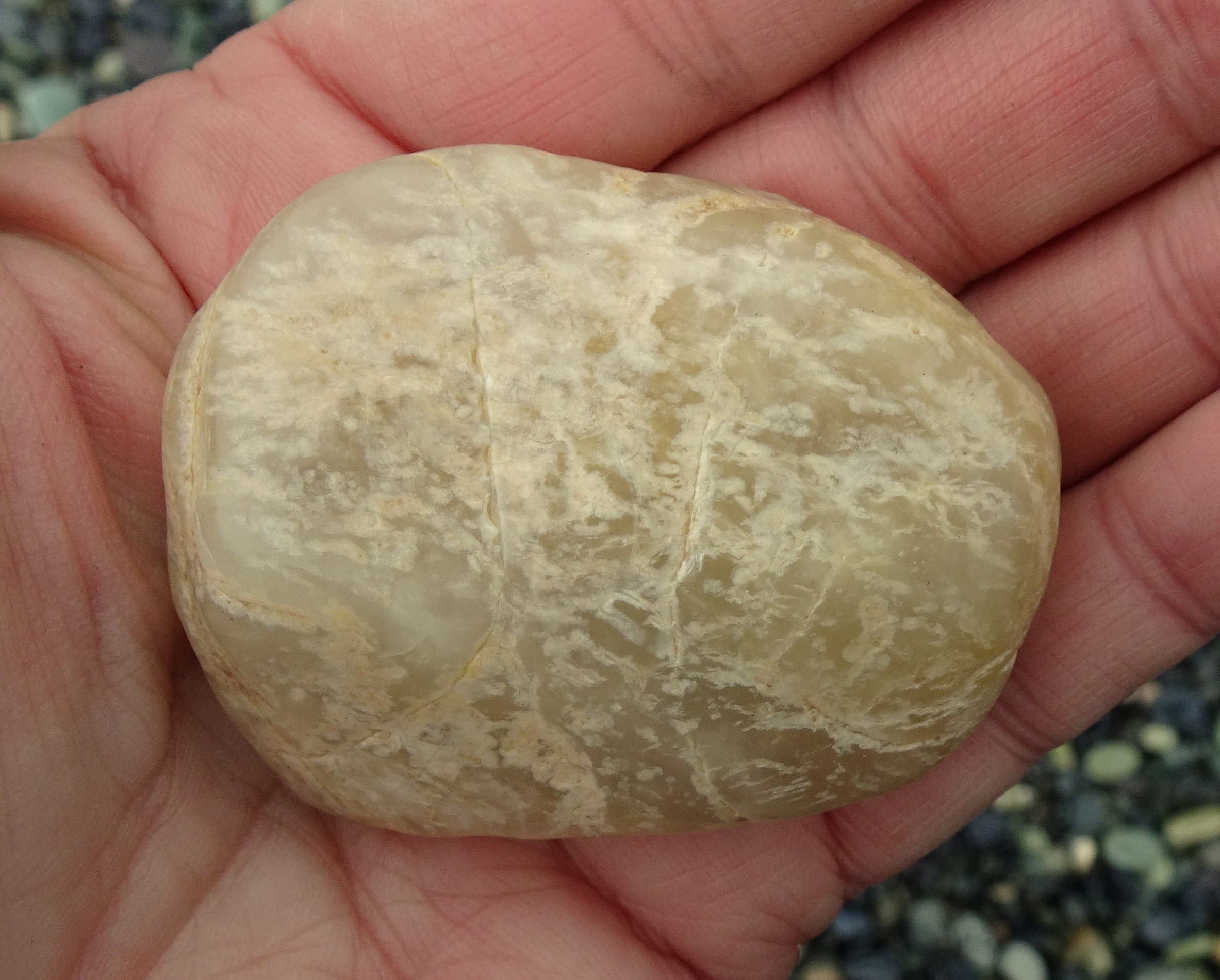 Very glassy type of hydrogrossular garnet.