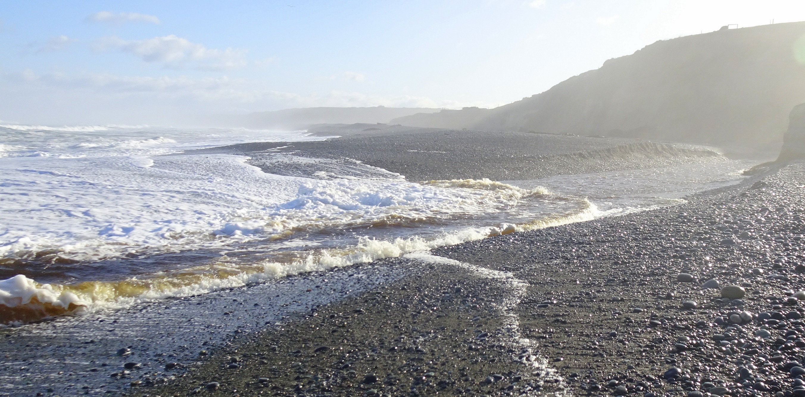 Wave sweeping up the river.