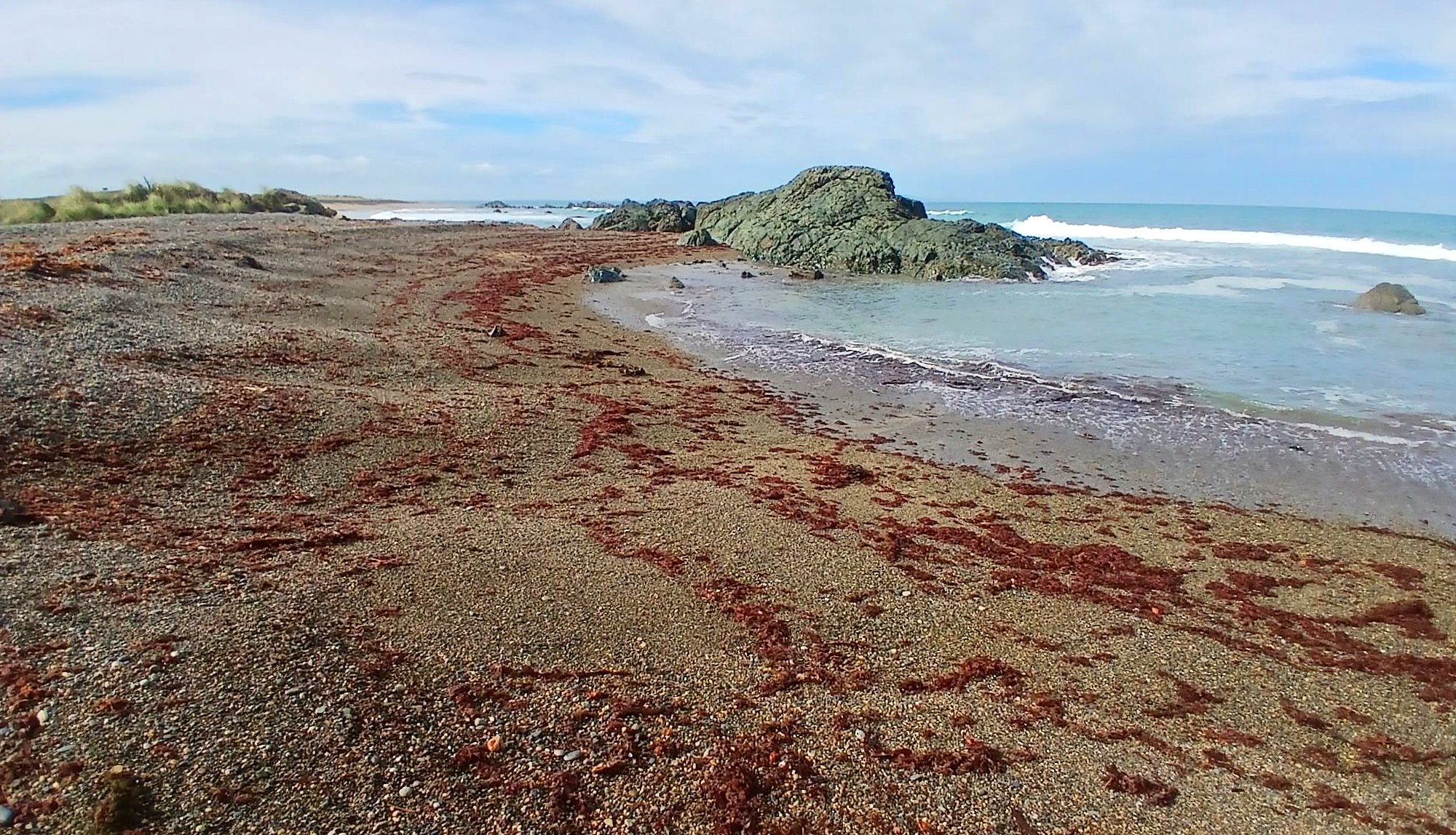 The small cove at the western end of the beach.