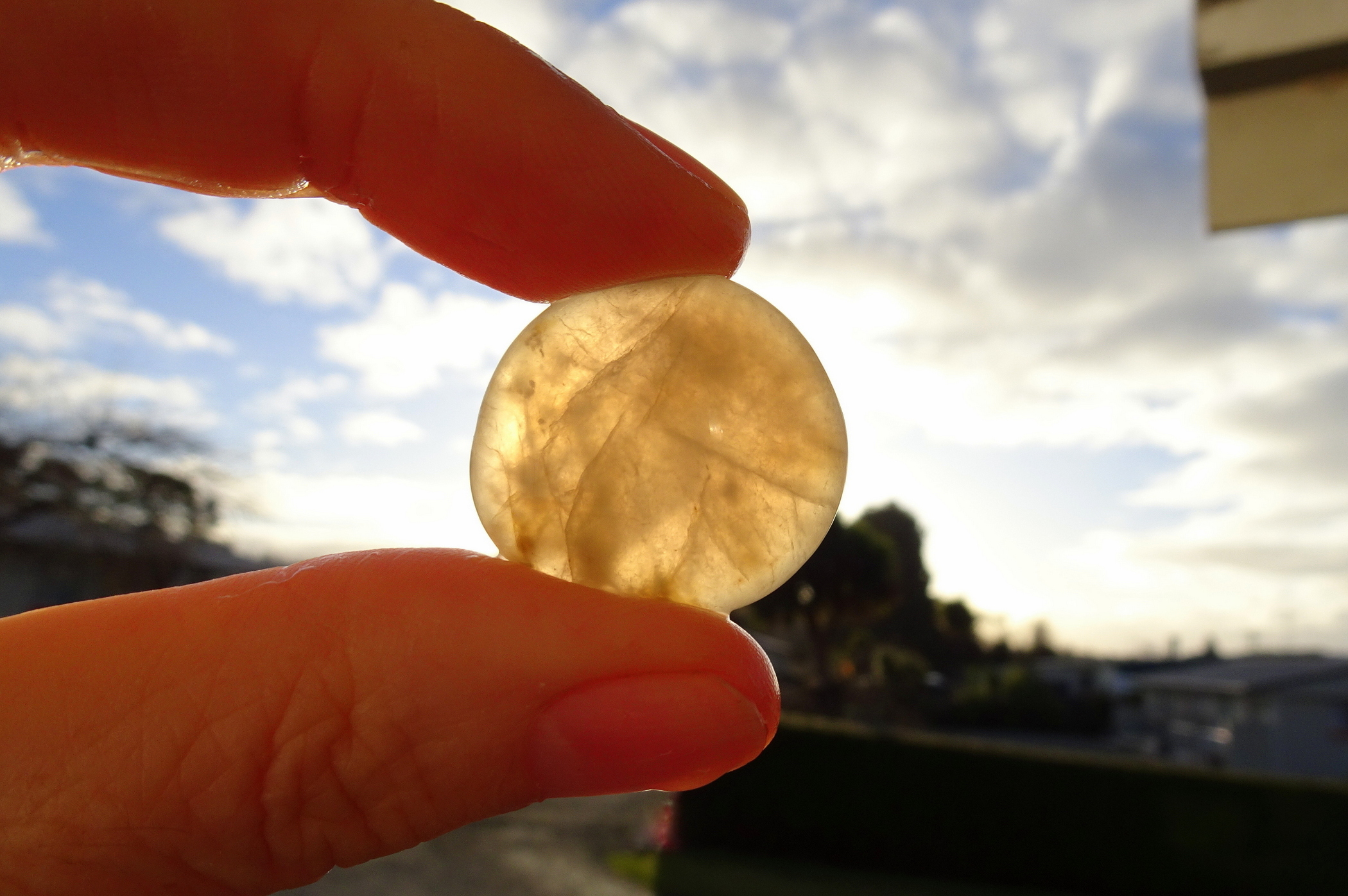 Cloudy quartz held up to light.