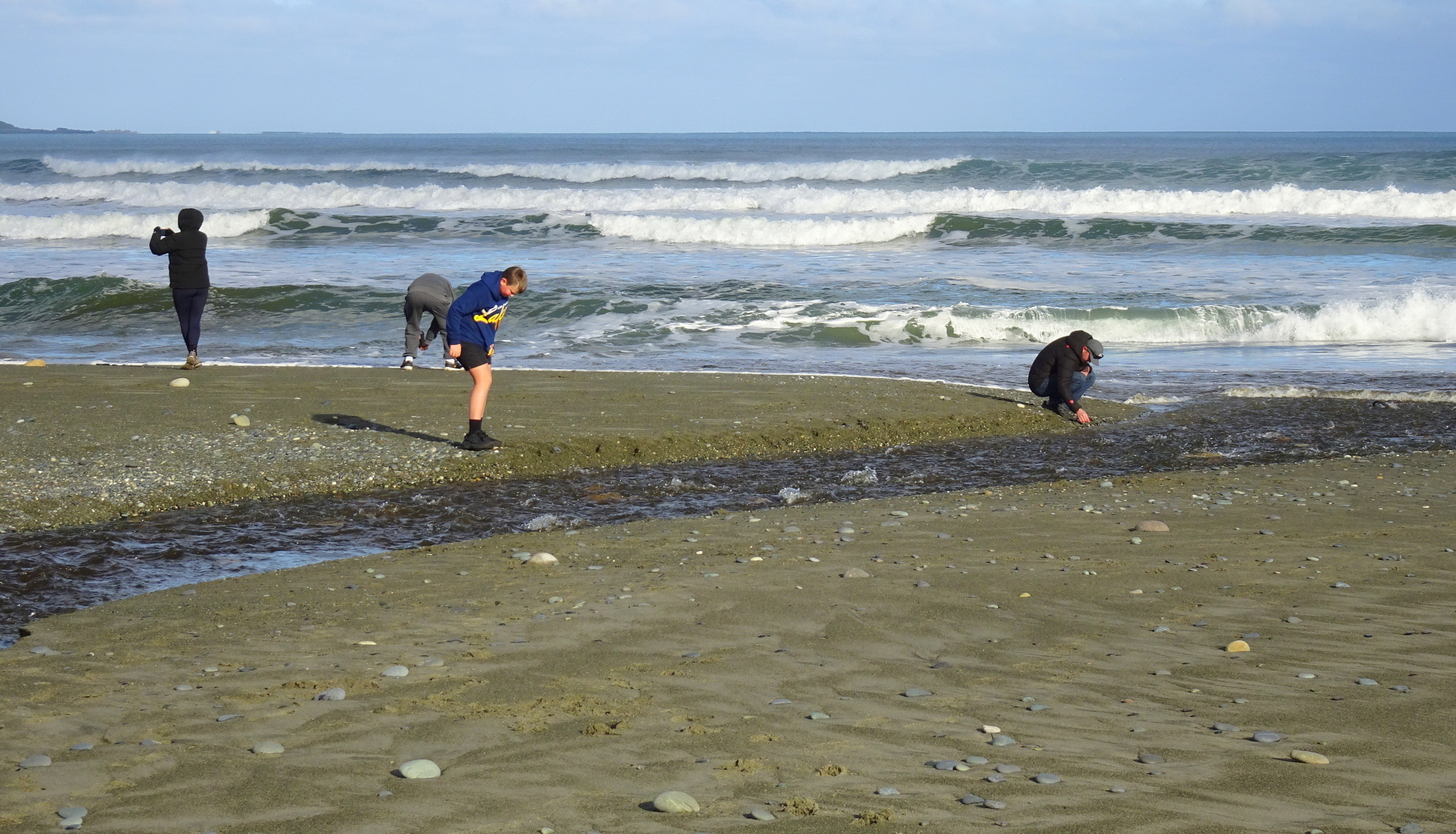Fossickers at the mouth of the Taunoa Stream.
