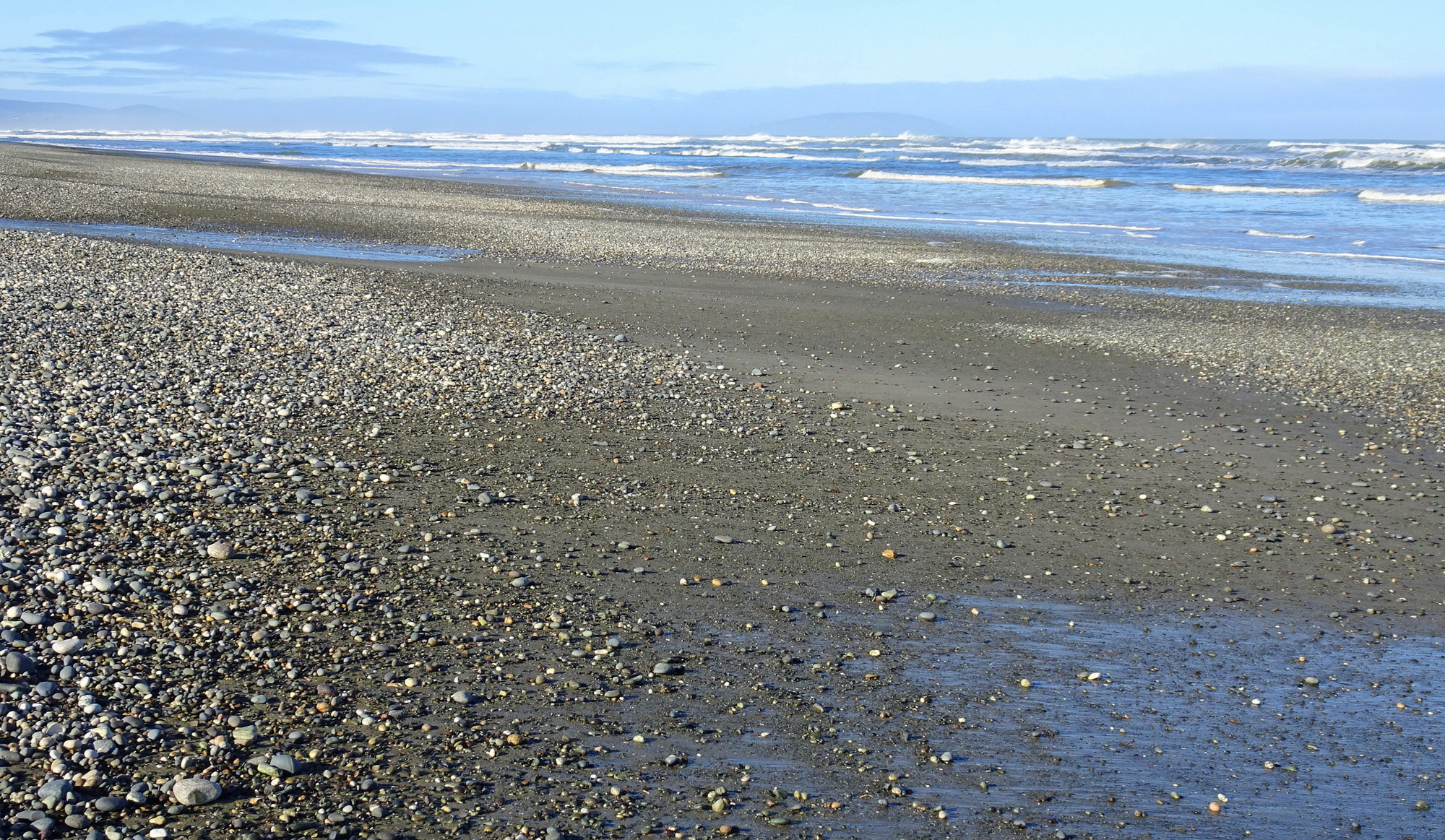 Looking east, more sand than when the tide is higher.