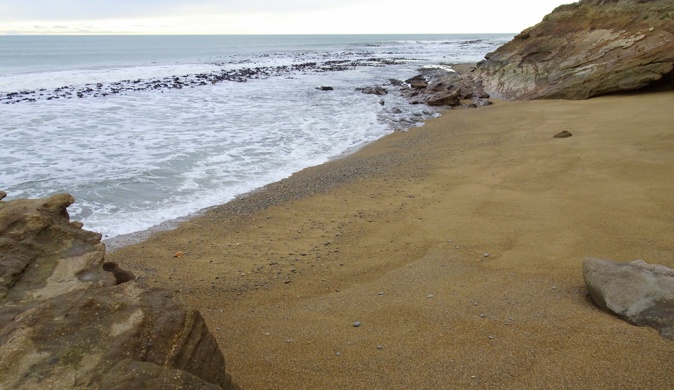 The first two bays in the rocks had a scattering of stones.