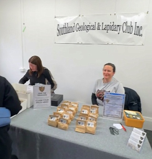 Tina (right) and Sorsha at the Club table, ready to hand out prizes. Source: www.facebook.com/sglc.rocks.