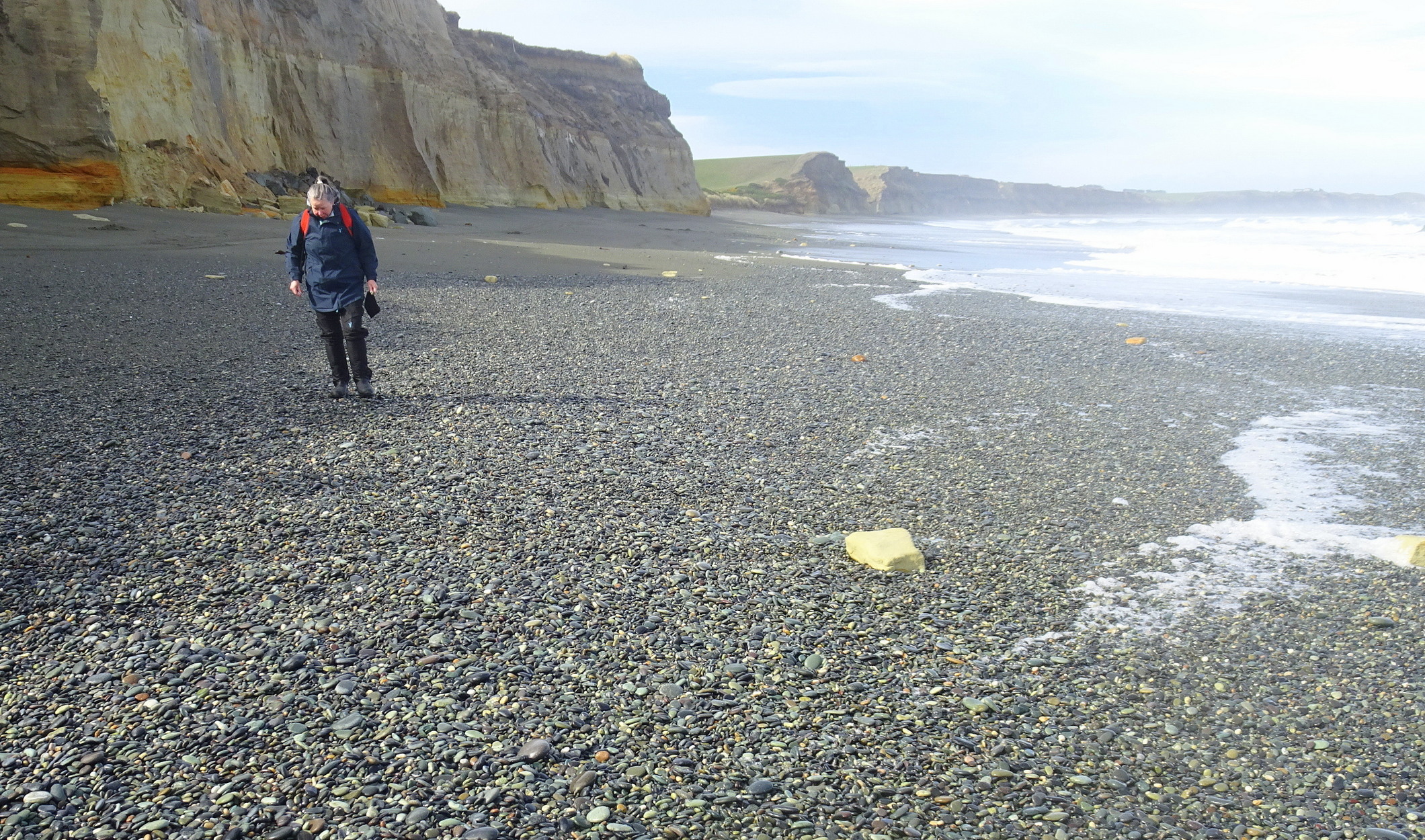 Lots of stones further along the beach.