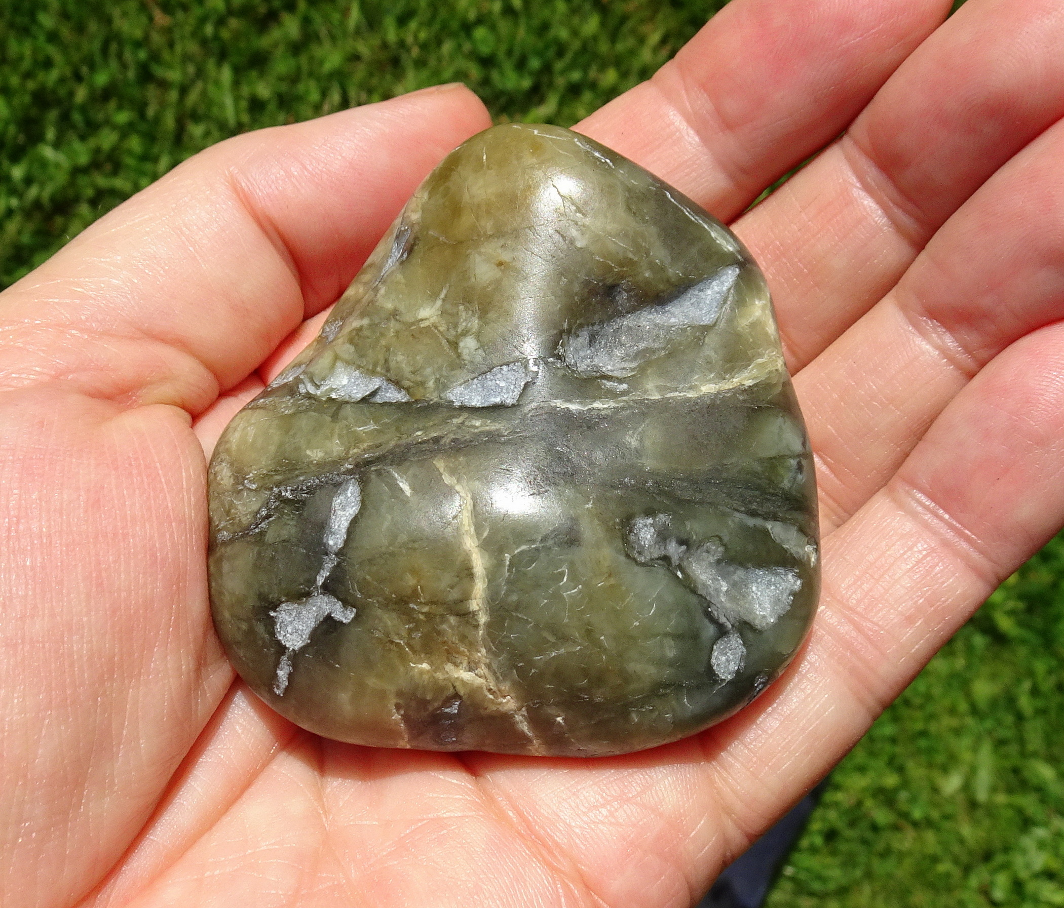 Stone D, opaque dark coloured hydrogrossualar garnet.