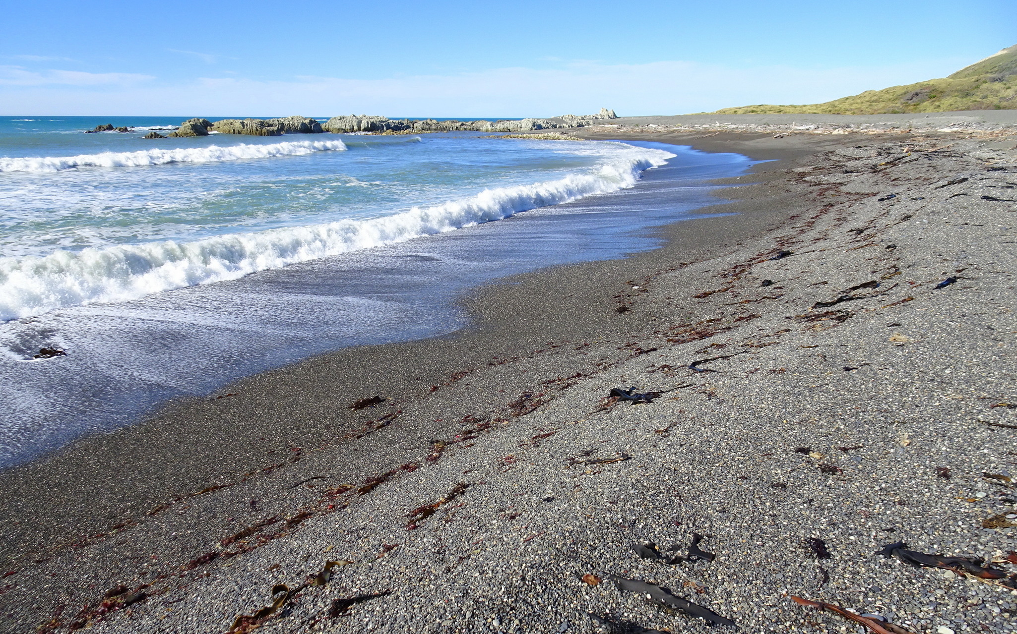 At the waves' edge.