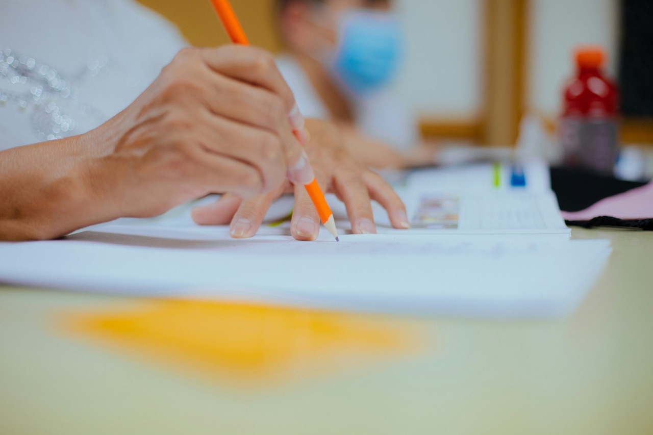 Person writing on paper