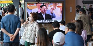Kim oversees N. Korea military parade showcasing new drones, ICBMs