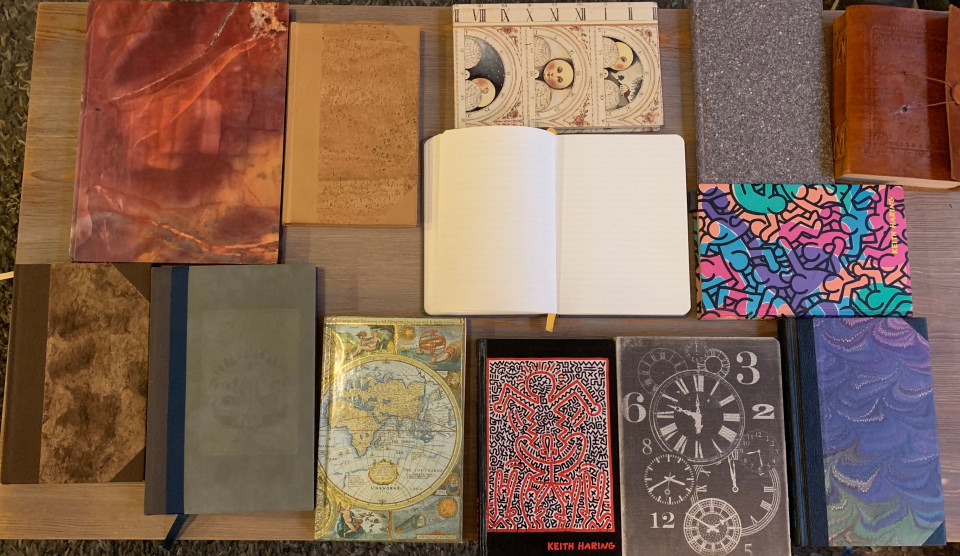 various notes and journals lying on a table.