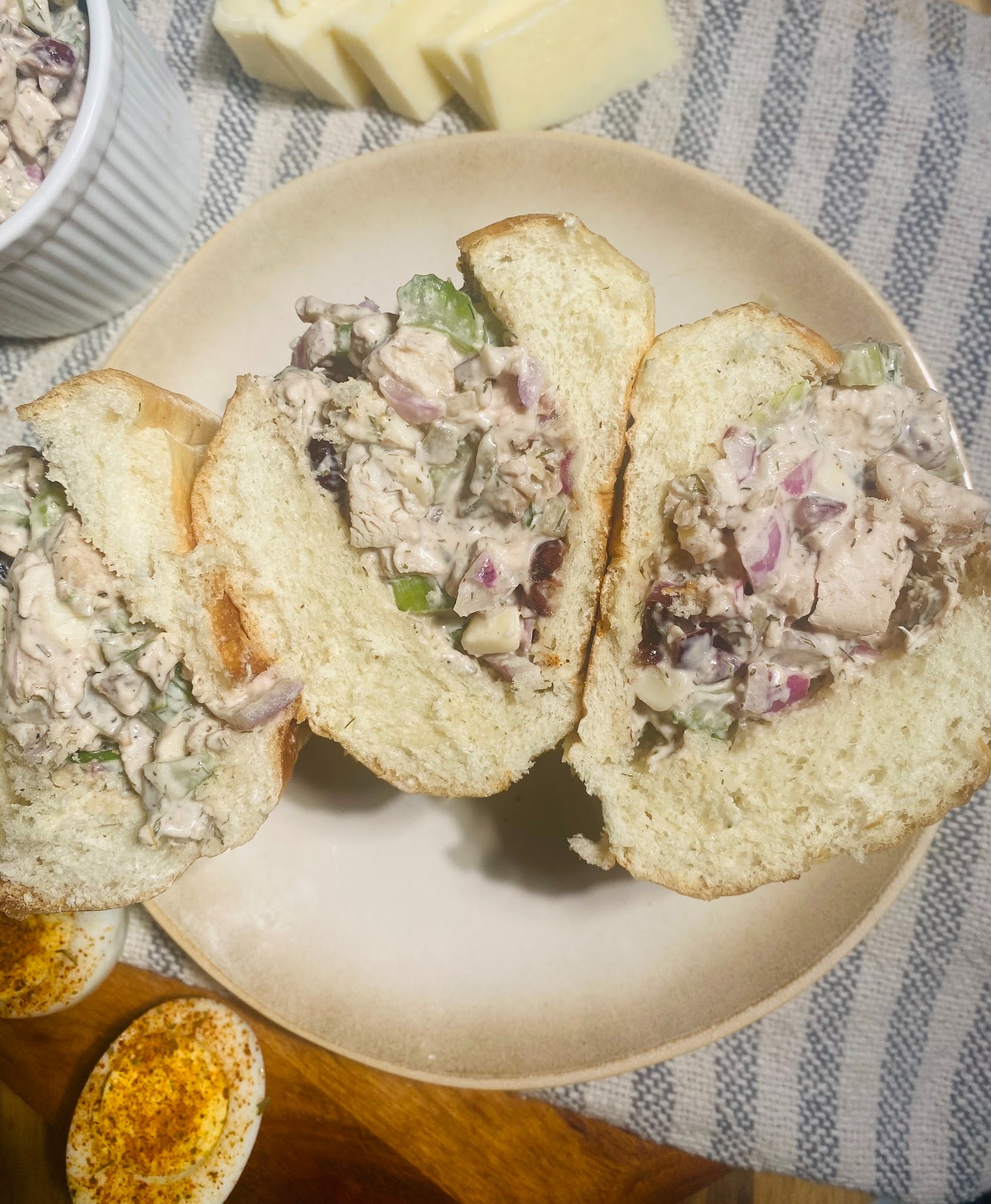 Overhead shot of the white cheddar chicken salad in a hoagie roll plated