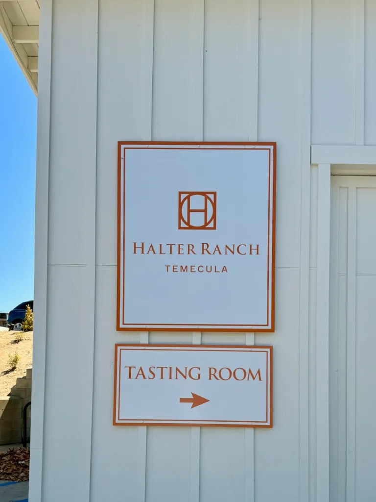 A sign that reads "Halter Ranch Temecula Tasting Room"