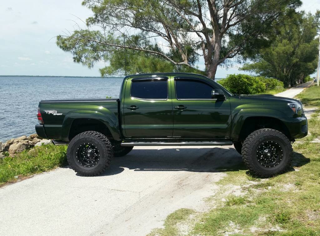 Dark green toyota tacoma