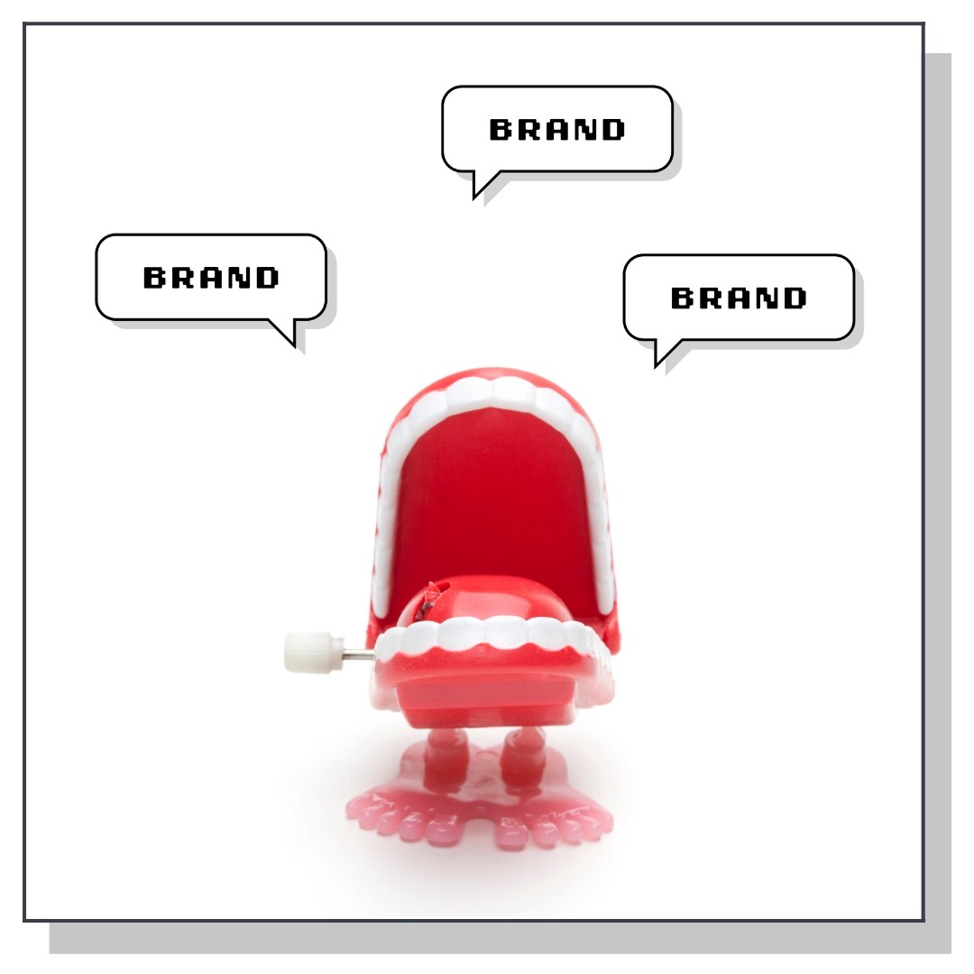 wind up chattering teeth toy with "brand" speech bubbles