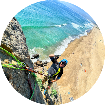 Climber on a sea cliff above the ocean