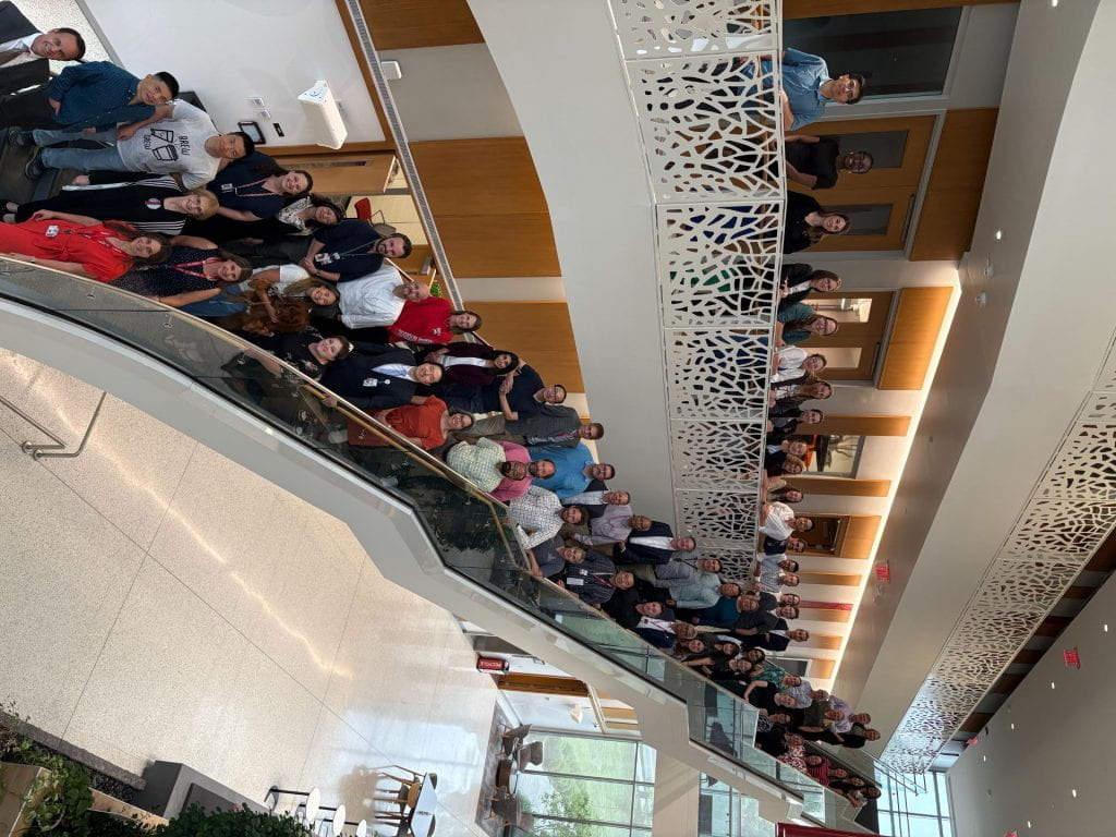 Full 2024-2025 FLI cohort posing for a photo on a staircase