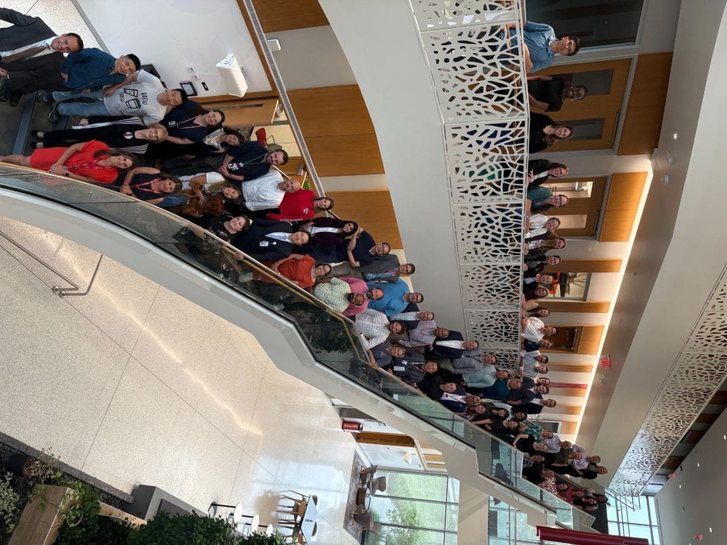 Full 2024-2025 FLI cohort posing for a photo on a staircase