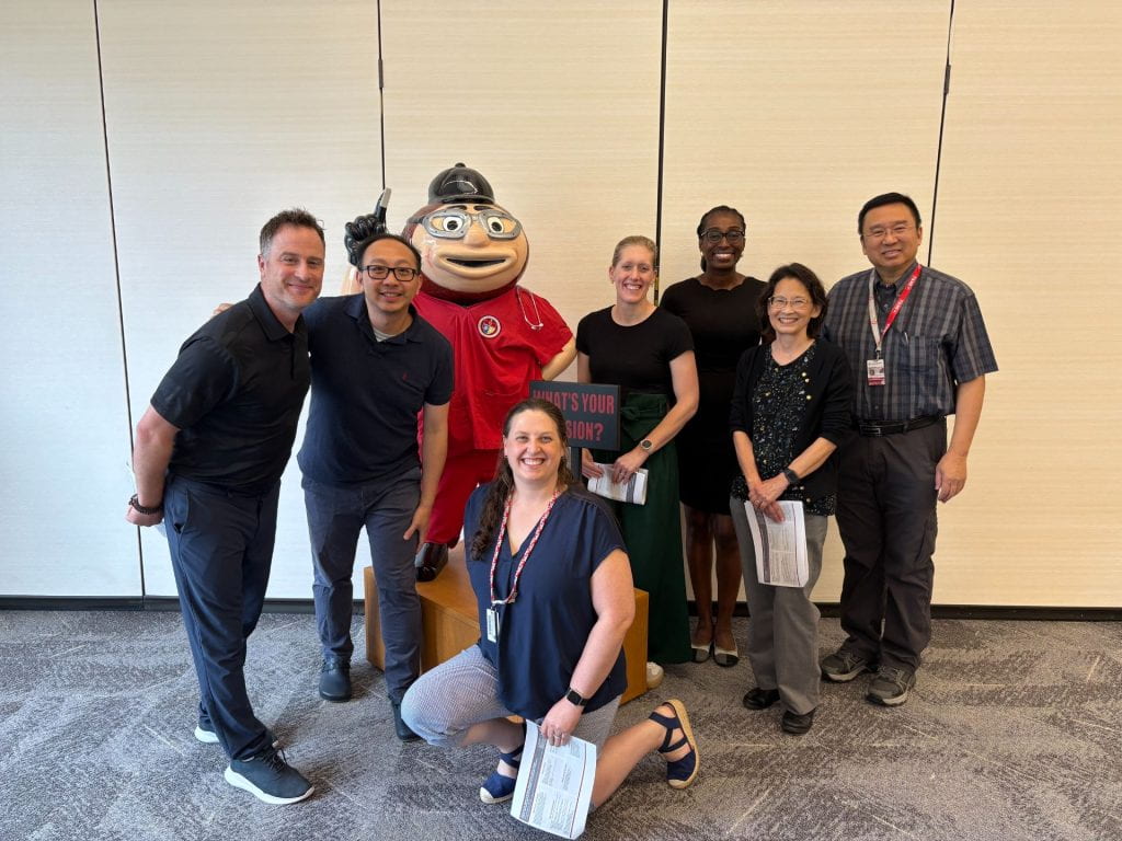 FLI Team 6 group in front of Brutus Buckeye statue