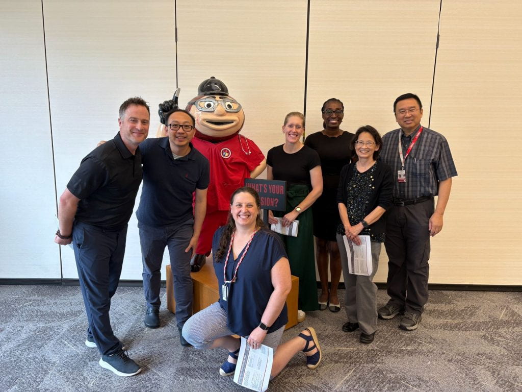 FLI Team 6 group in front of Brutus Buckeye statue