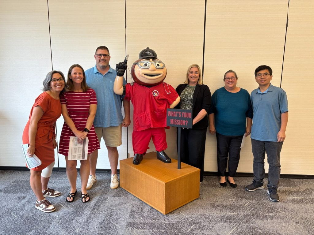 FLI Team 7 group in front of Brutus Buckeye statue