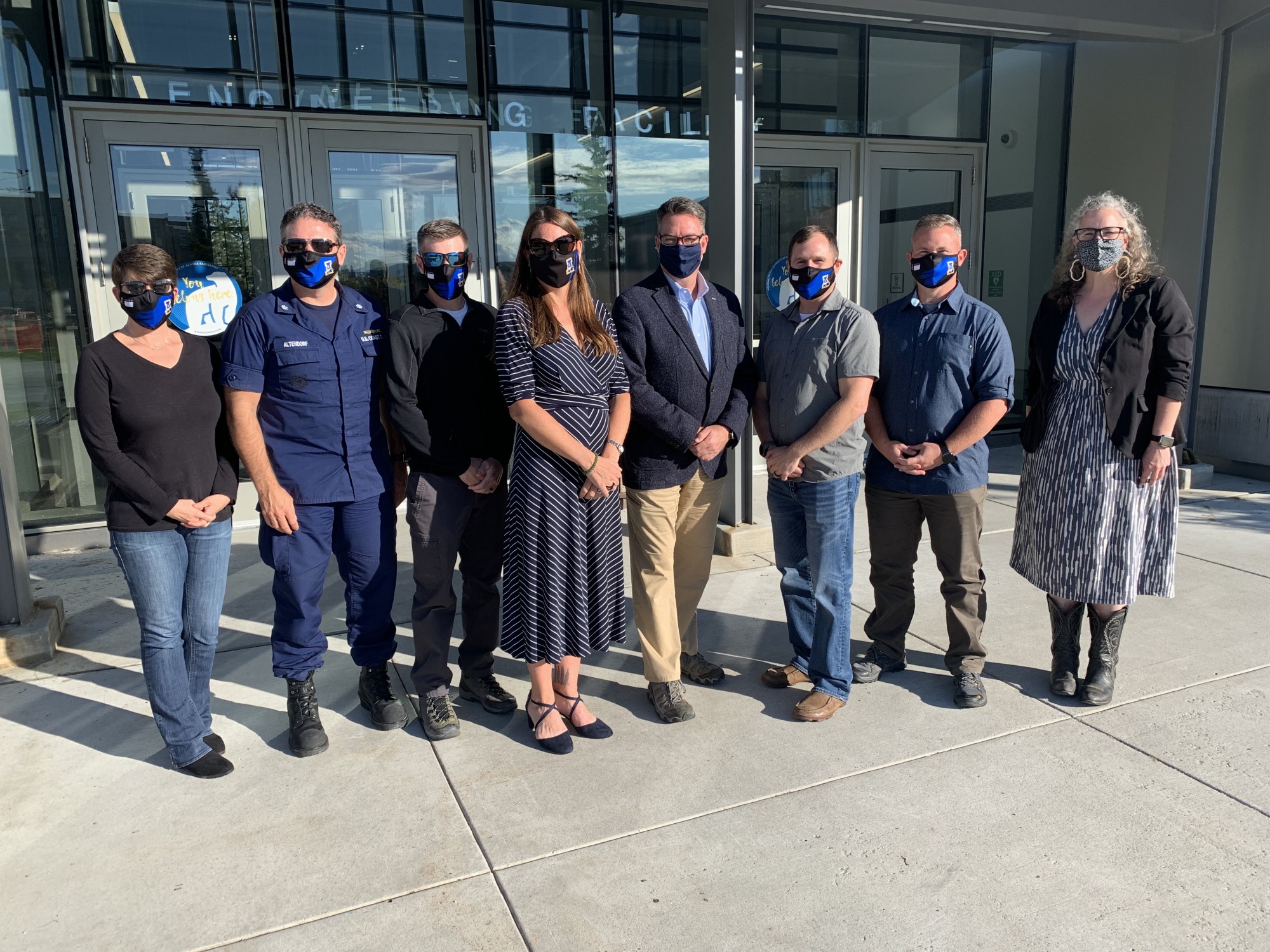 International Arctic Research Center "IARC" Researchers and US Coast Guard officials pose for a photo.