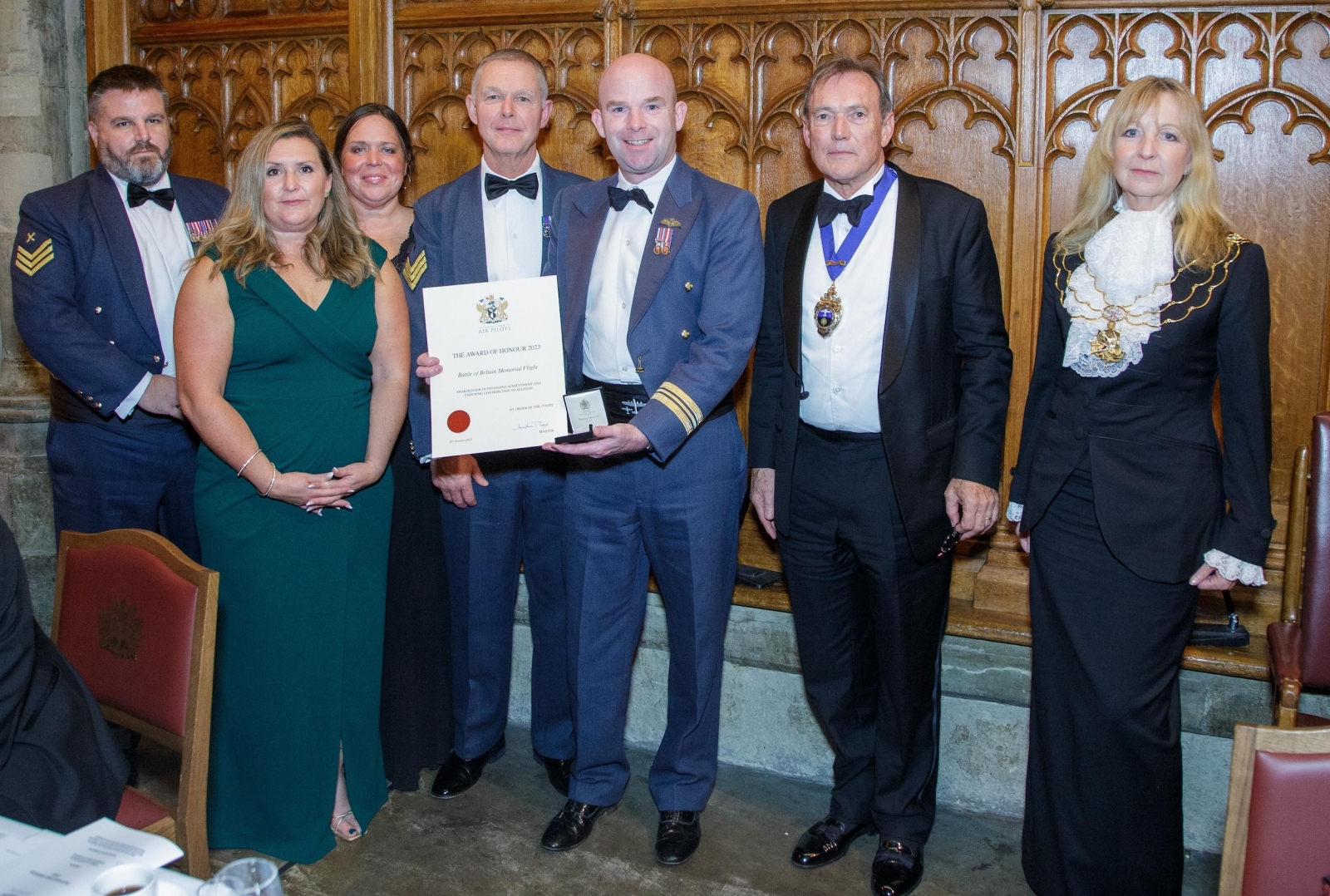 OC BBMF, Sqn Ldr Mark ‘Suggs’ Sugden, holds the certificate for the Award of Honour. Left to right: Chief Technician Stu Read, Chief of Staff Flt Lt Emma Phillips, Admin Officer Diane Law-Crookes, Chief Technician Jeff Gullliver, OC BBMF, Capt Jonathan Legat, Master of the Honourable Company of Air Pilots, and Dame Susan Langley DBE, Representative Lord Mayor, City of London.