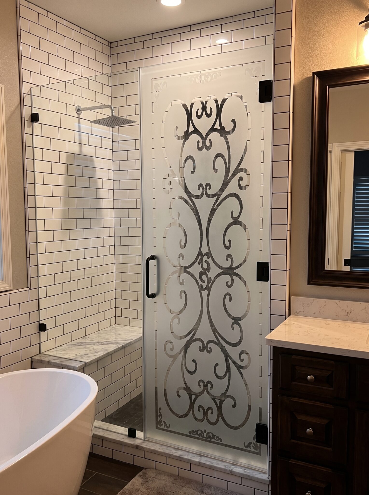 Decorative shower doors and entry glass with custom sandblasted design