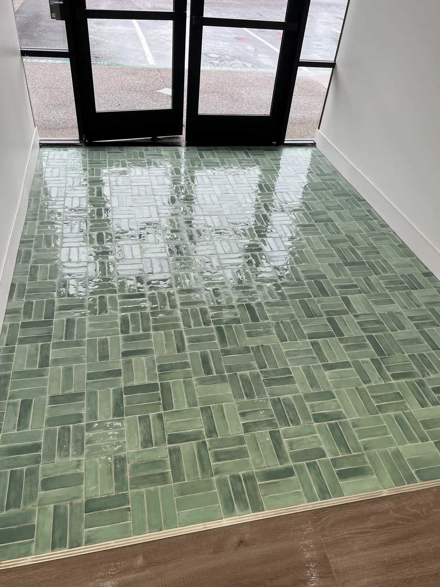Freshly cleaned and polished commercial entryway tile and grout flooring in San Diego