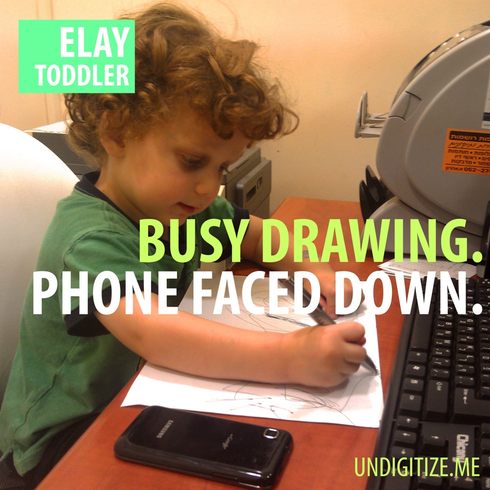 Busy Drawing. Phone Faced Down.