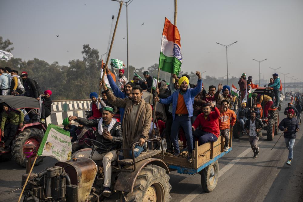 Indian lawmakers repeal farm reforms after year of protests