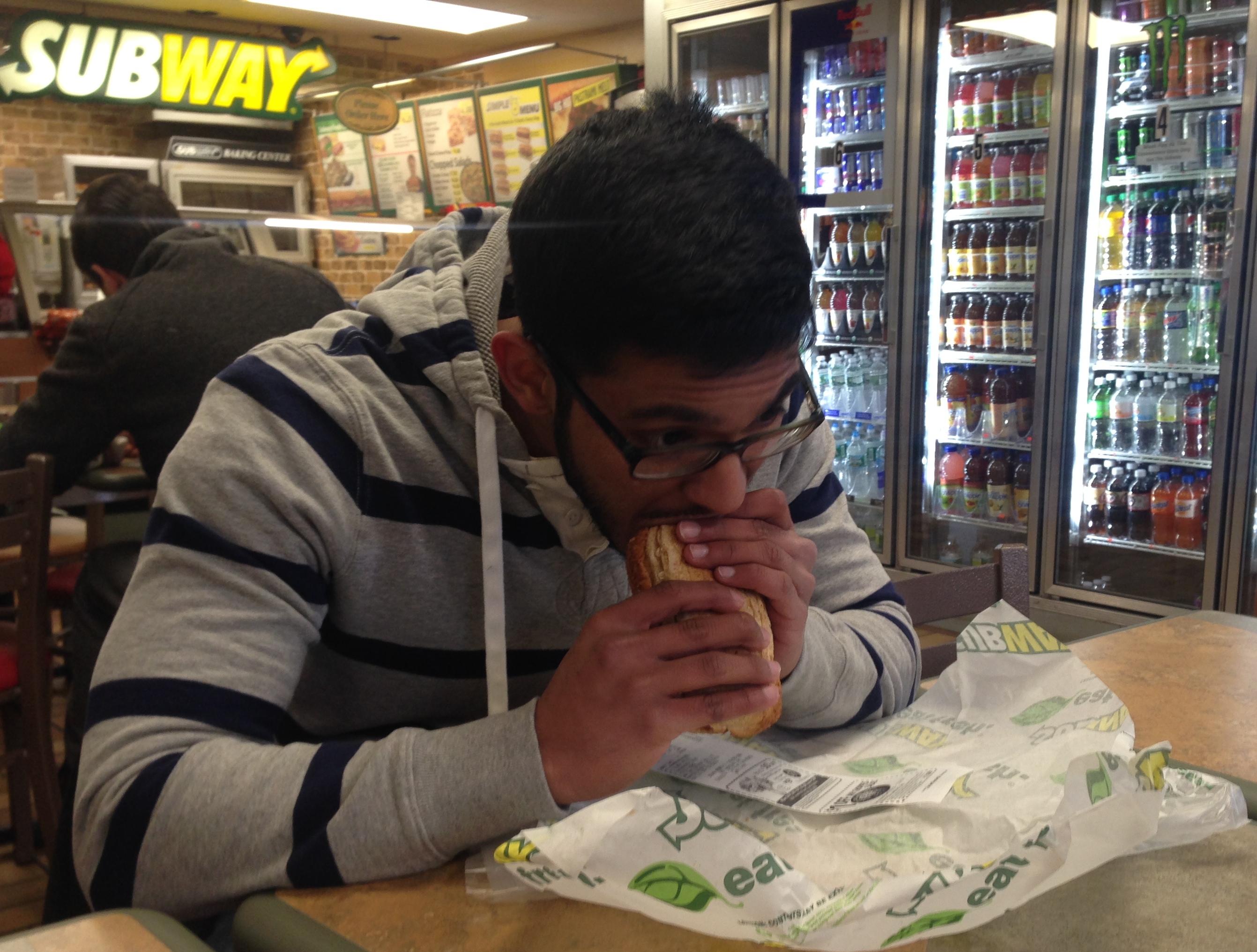Melvin Mehidi, a Sophomore at Hofstra University eating at a Subway restaurant located outside of campus.