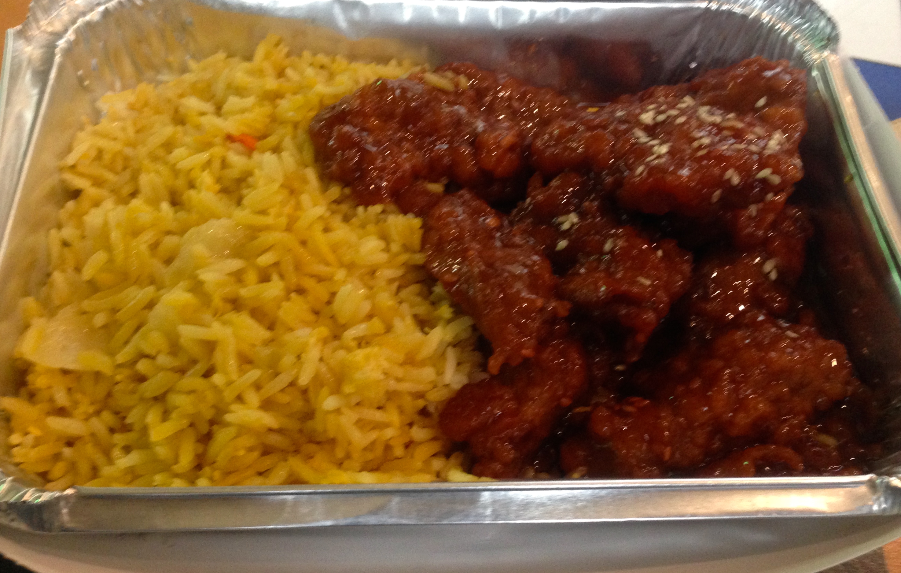 One of the many types of food that Lackmann provide. ( fired rice with sesame chicken)
