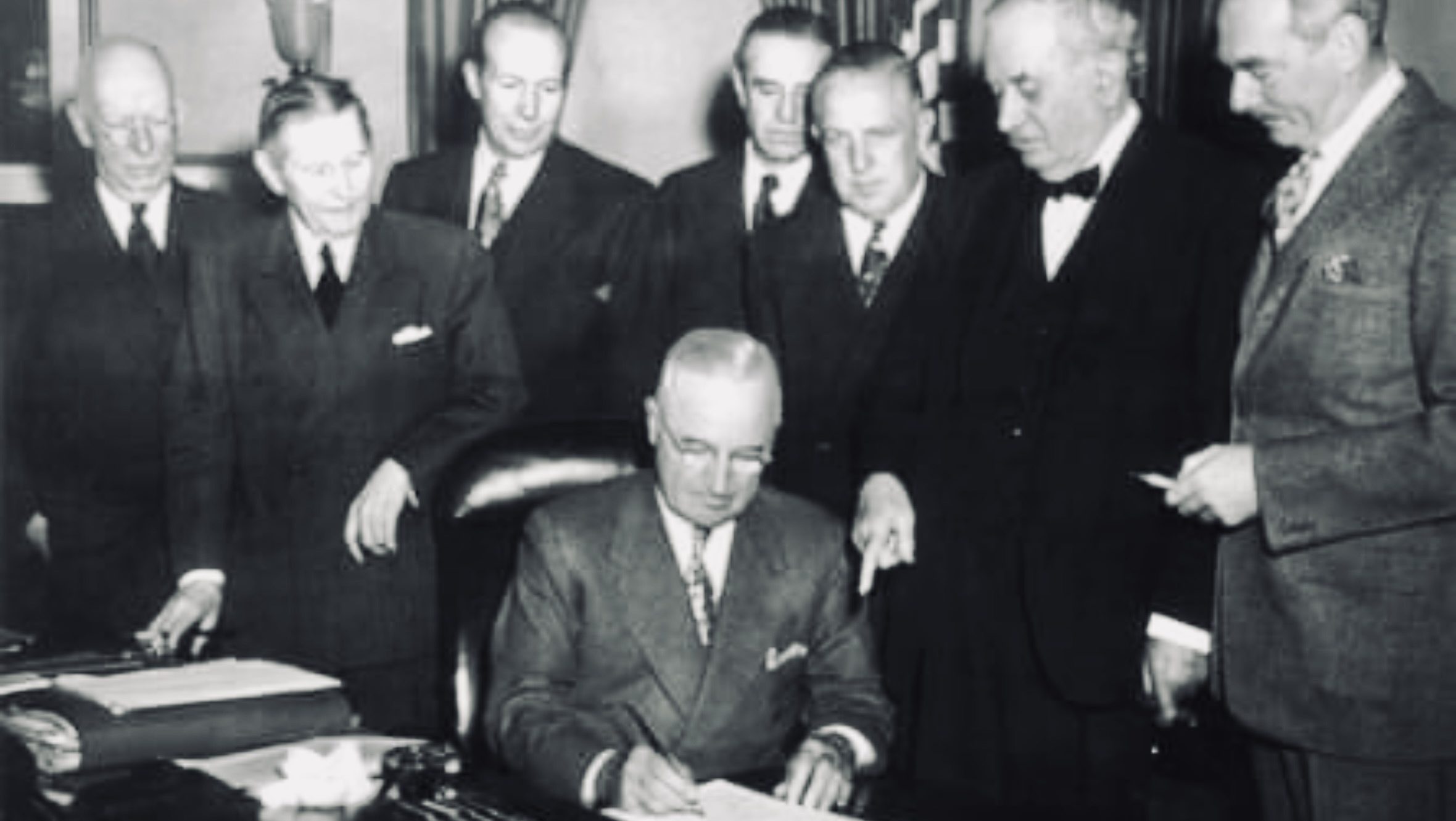 U.S. President Harry S. Truman signs the Economic Cooperation Act in 1948, launching the Marshall Plan to aid Europe