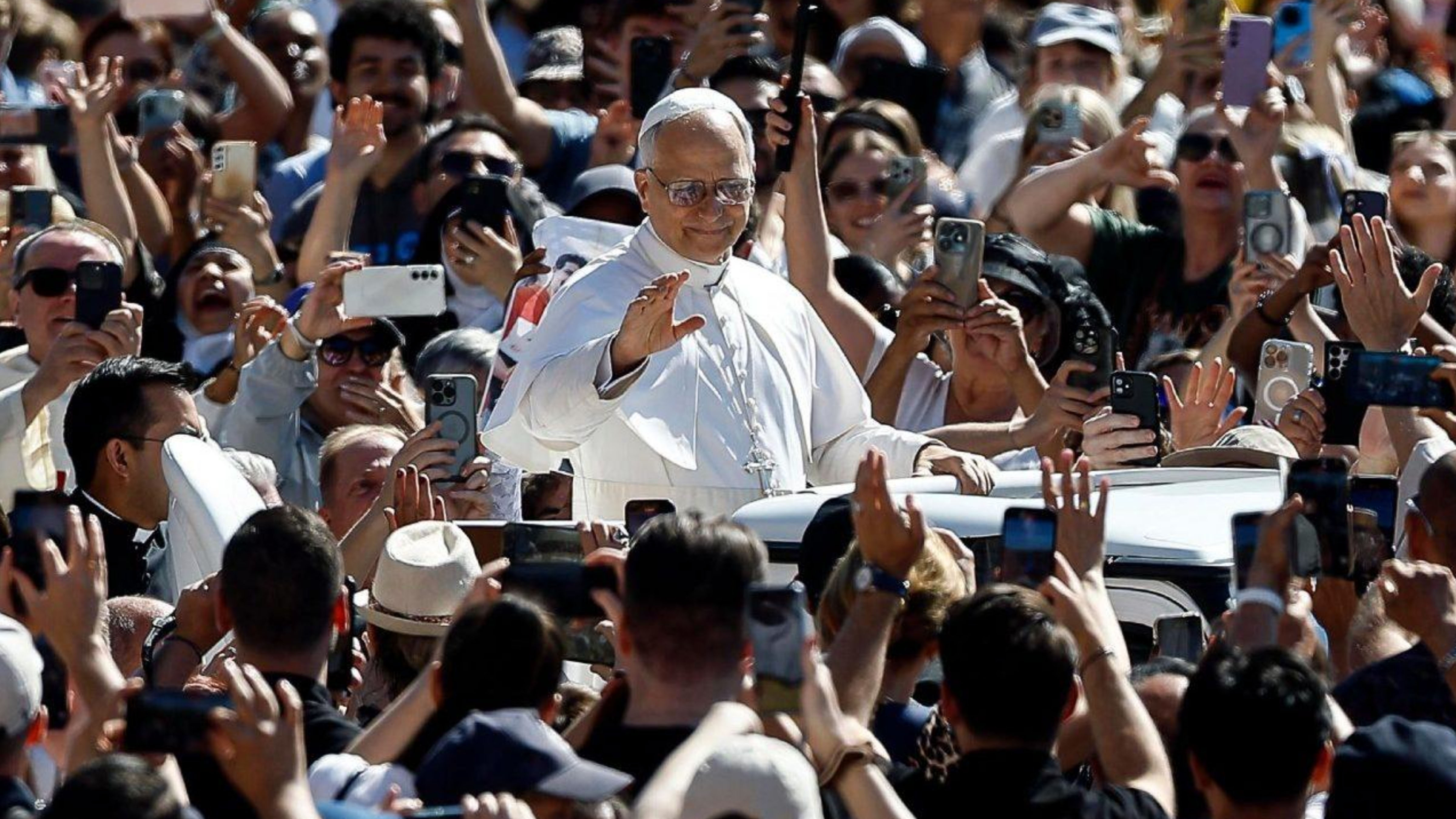 Pope Leo XIV waving to a large crowd gathered at the Vatican as global attention grows around the Catholic Church’s upcoming declaration on artificial intelligence ethics.