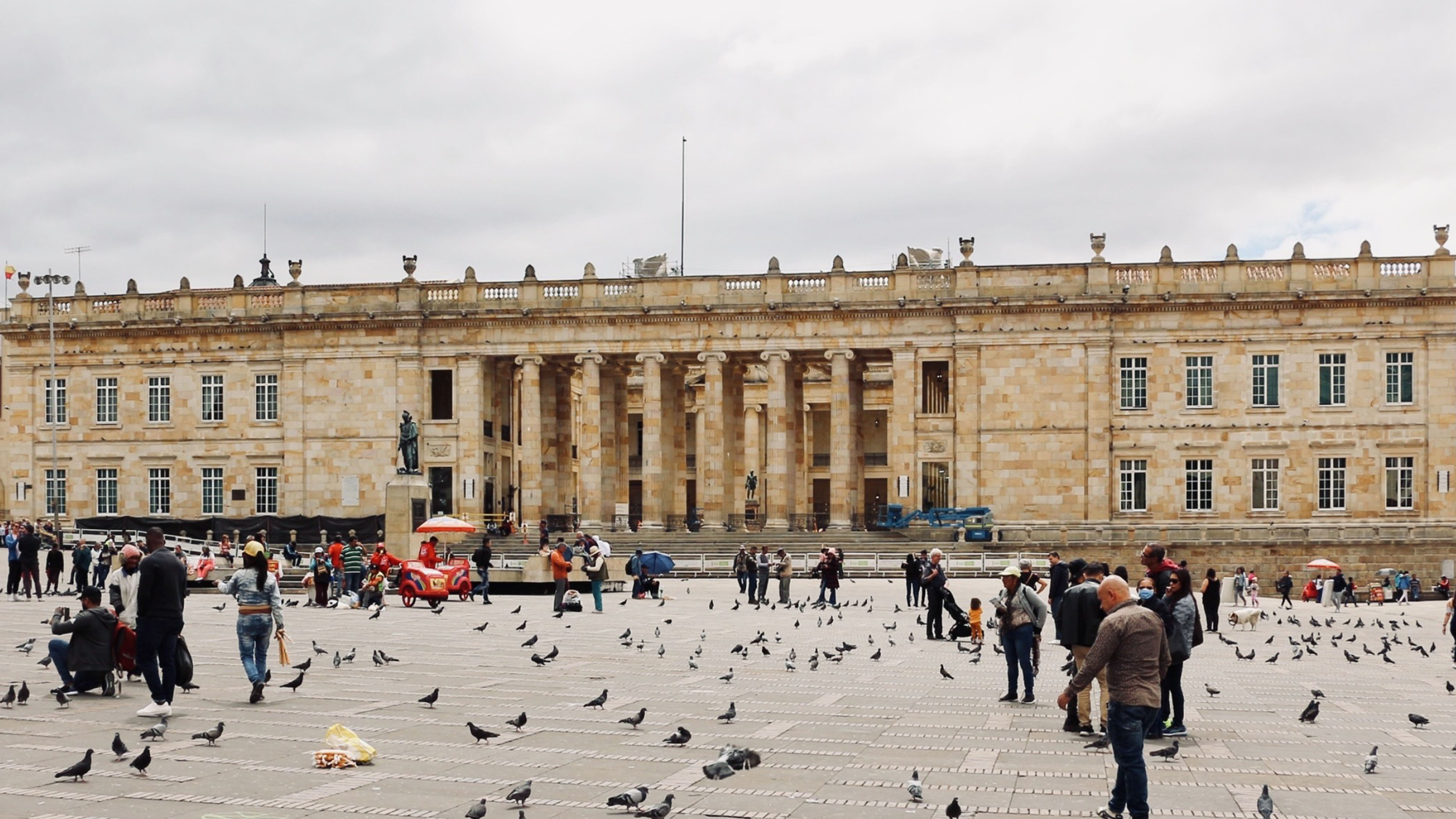 People gather in Plaza Bolívar in front of Colombia’s National Capitol in Bogotá as the country prepares for a closely watched election with regional implications.