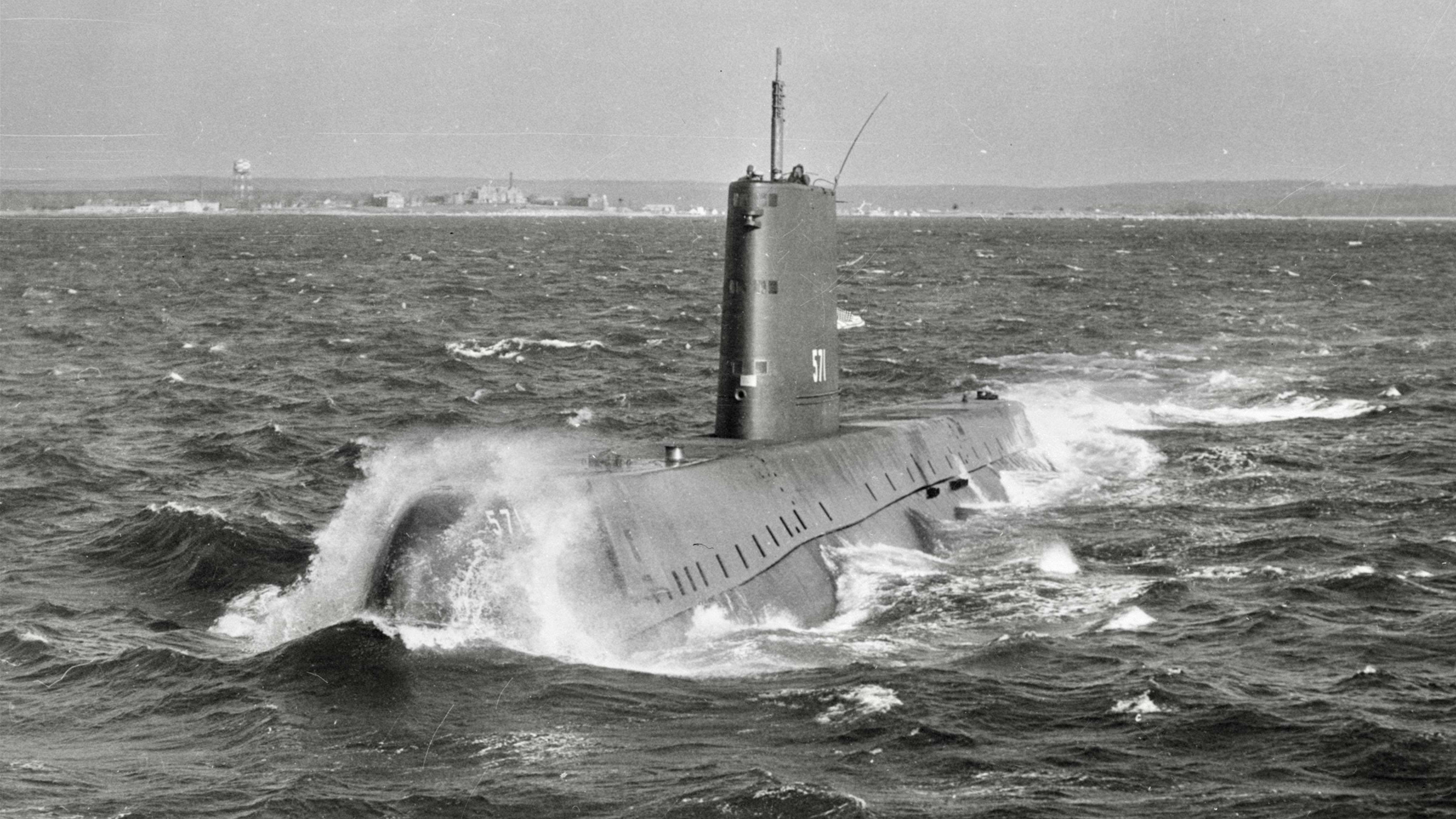 Black-and-white photograph of the USS Nautilus (SSN-571), the world’s first nuclear-powered submarine, underway at sea.