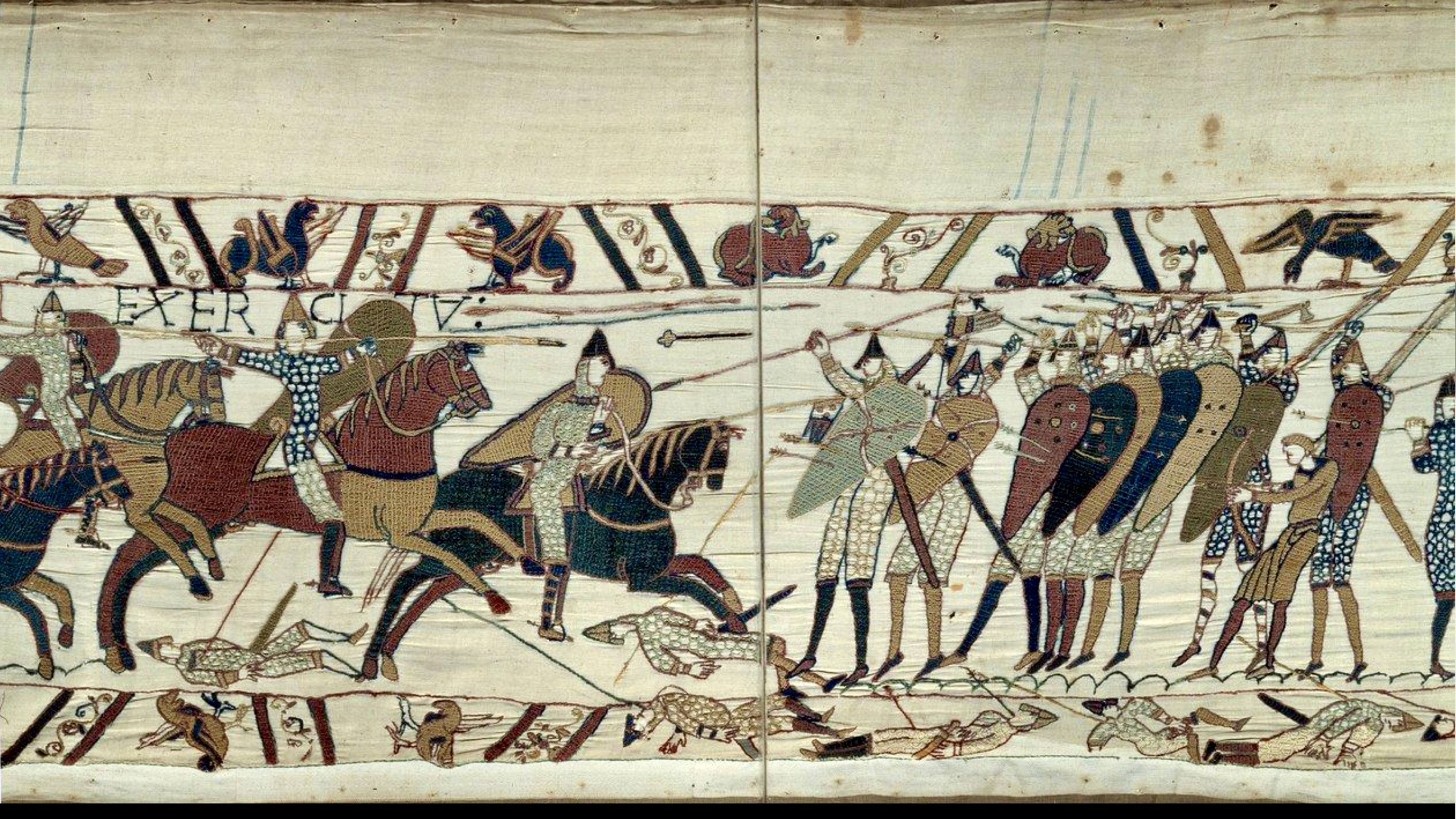 Detail of the Bayeux Tapestry depicting Norman cavalry attacking English soldiers defending a shield wall during the Battle of Hastings in 1066.