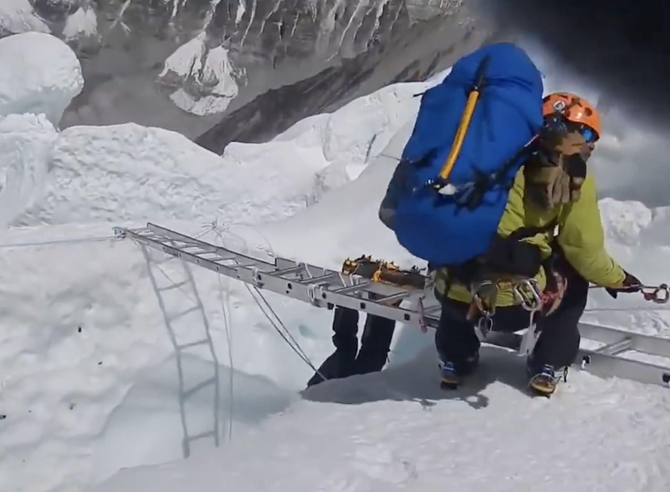 Climber falls into a crevasse on Everest.