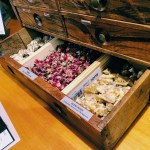 Apothecary cabinet with elemi resin, dried roses, at the Aftel Archive of Curious Scents.