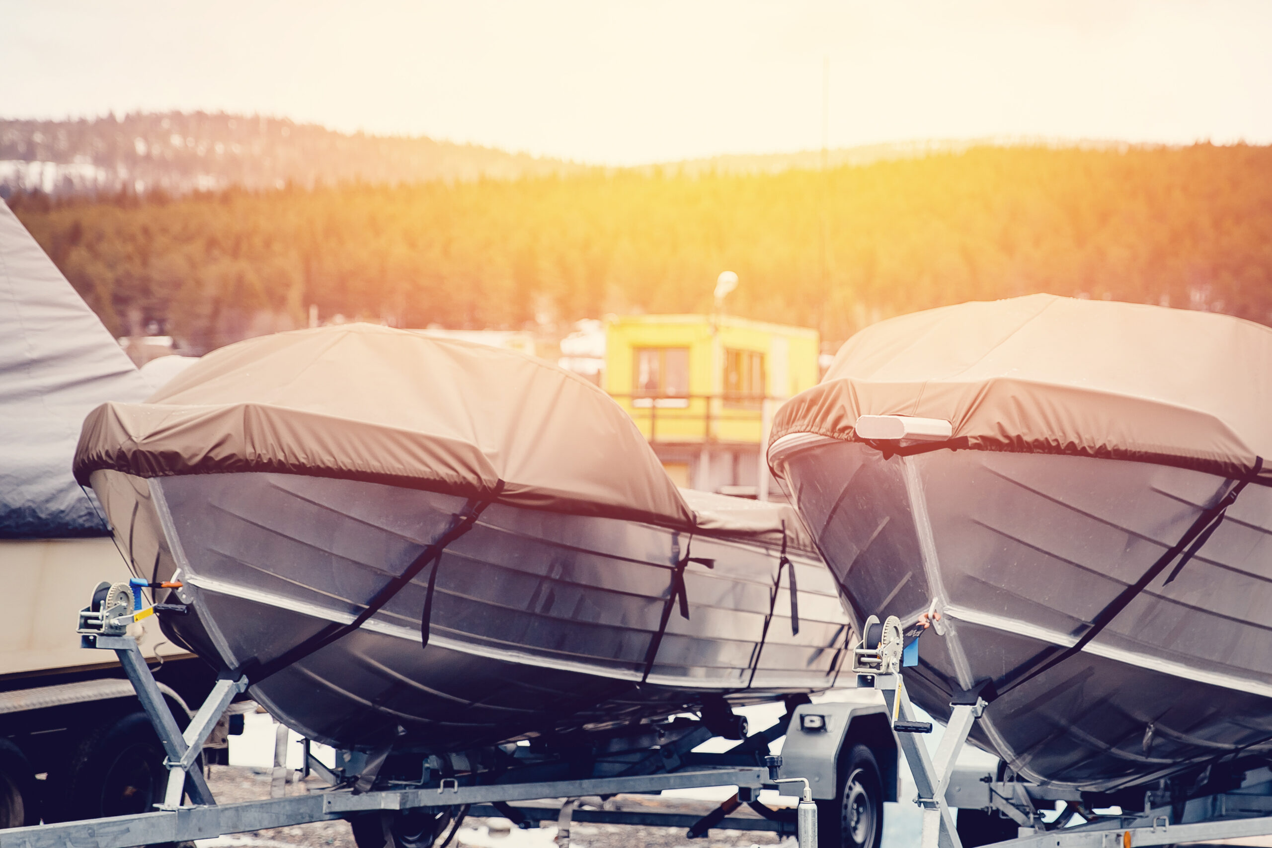 Storage vessels, boats, ships. Boats are protected by a tent from rain and winter. Stock.