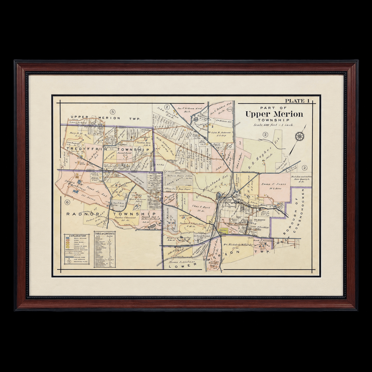 Custom framing of a historic Upper Merion Township map with cream matting and a dark wood frame.