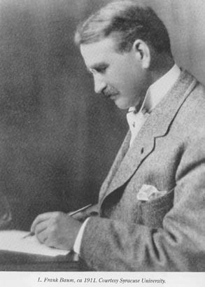 Writer L. Frank Baum, writing with pen.