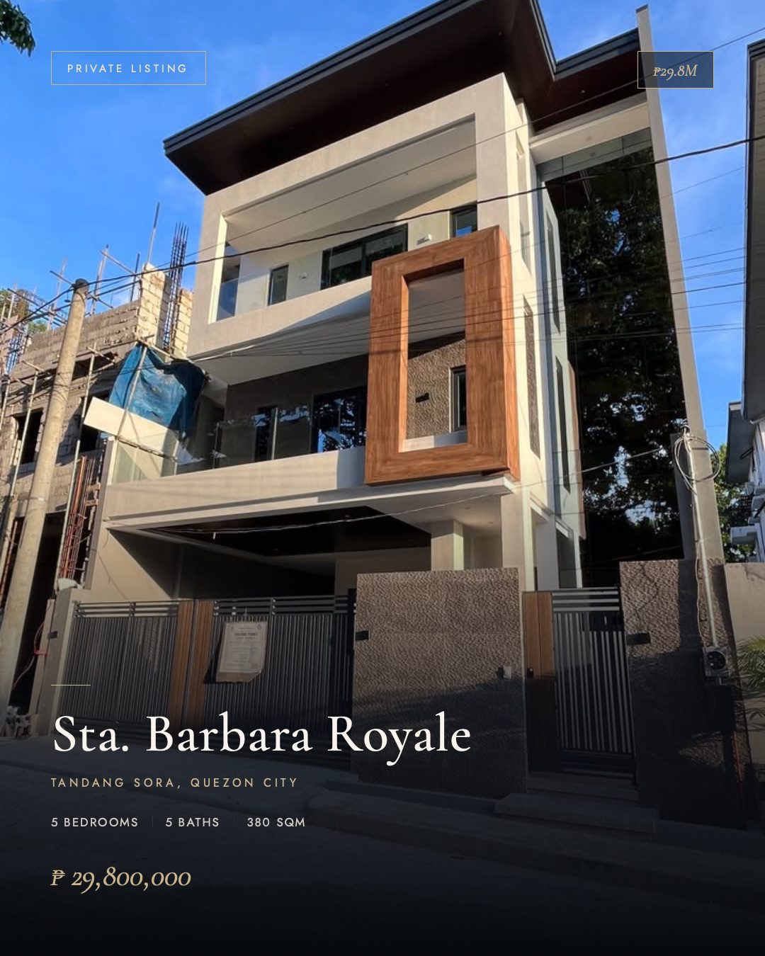 Front facade, dusk light. Three-story modern build with cantilevered dark eaves, wood-paneled accent above the entry, and a stone-clad perimeter wall with automated gate.