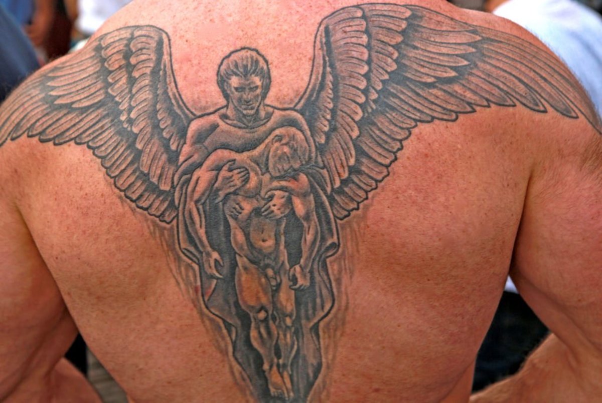 Angel Tattoo Meanings And Designs Tatring Tattoos Piercings