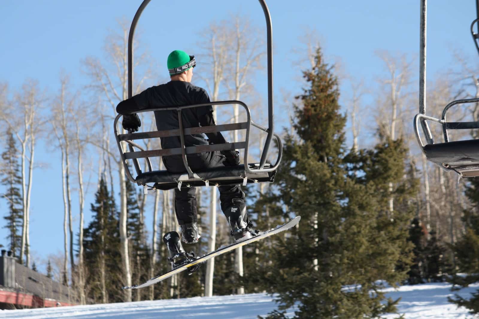 Person riding a scenic chairlift in Beaver City, Utah.