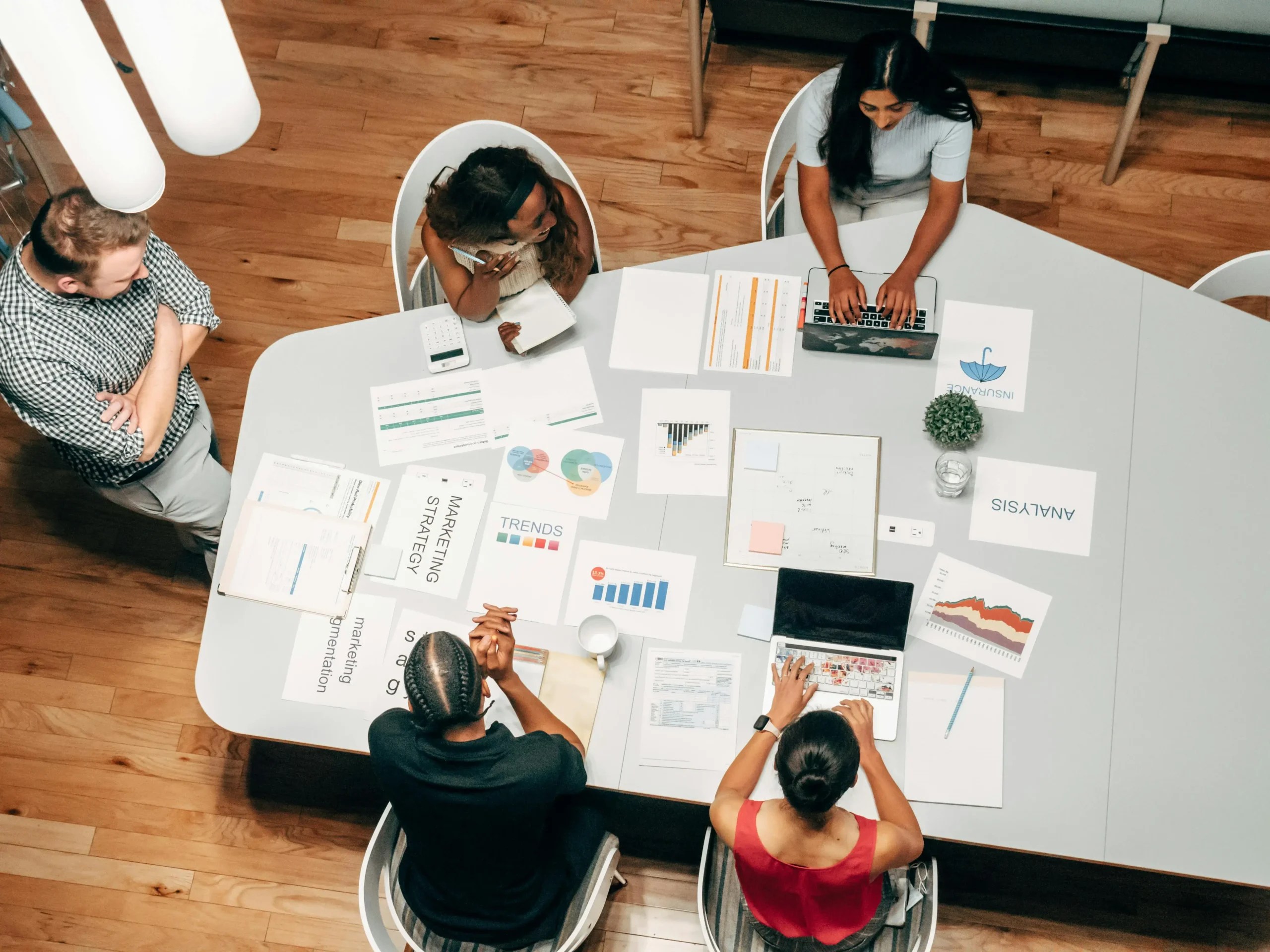 Professionals around a table planning for SEO
